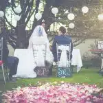bride and groom having wedding ceremony